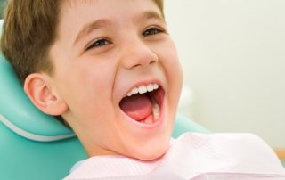 Young boy happy at the dentist