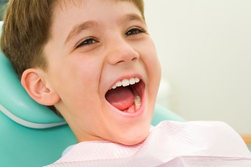 Young boy happy at the dentist